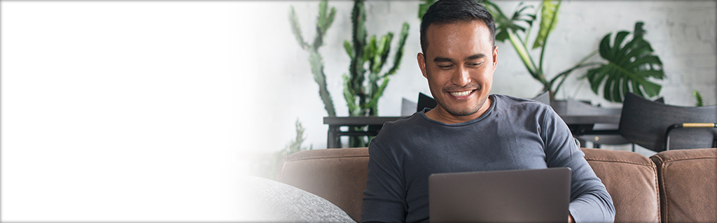 Man typing on a laptop computer